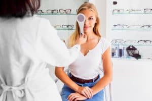 front-view-woman-during-eye-exam_23-2148273221